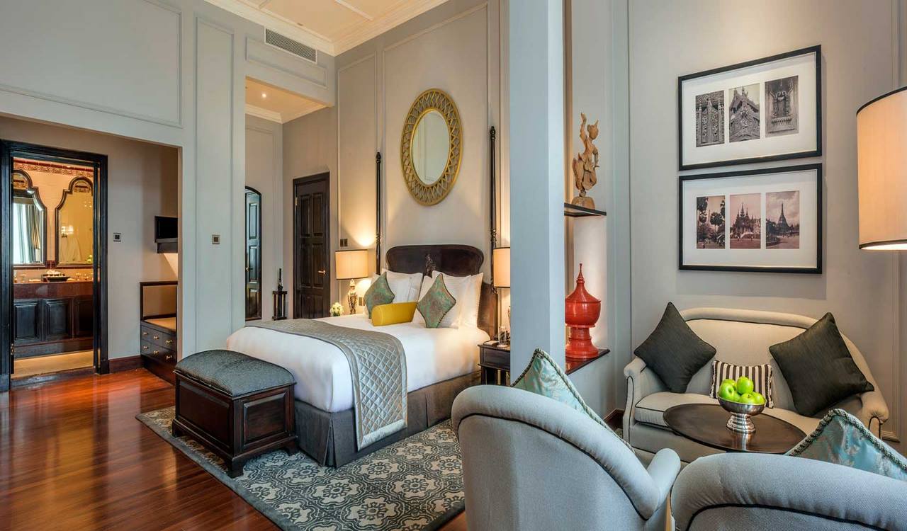 The grand white colonial facade of The Strand Yangon at dusk